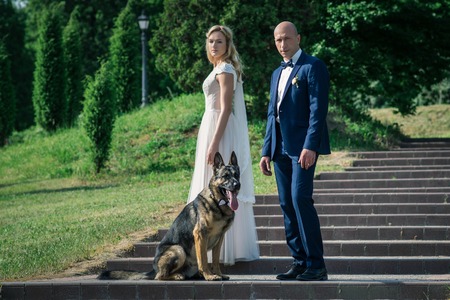 Bride and groom in a city park.