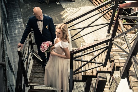 Bride and groom in a city park.の写真素材