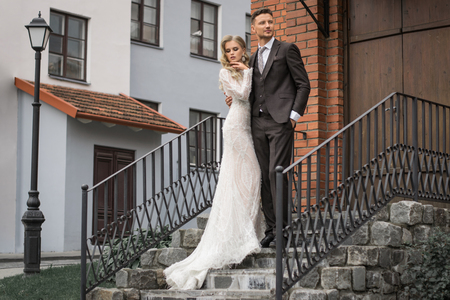 happy couple standing near modern city centerの写真素材