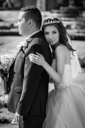 Lovely wedding couple kissing in the cityの写真素材