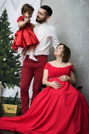 City chic young woman wearing a green dress and bootsの写真素材