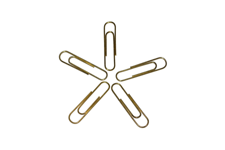 Snowflake of metal five golden clips on white background