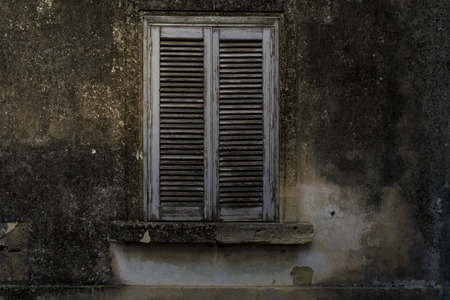 window of an old and abandoned houseの写真素材