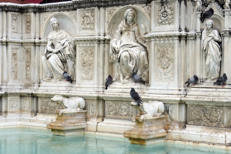 Fountain of Joy - Medieval marble fountain in Siena  Panel of the Fonte Gaia, Piazza del Campo, Siena, Italy の写真素材