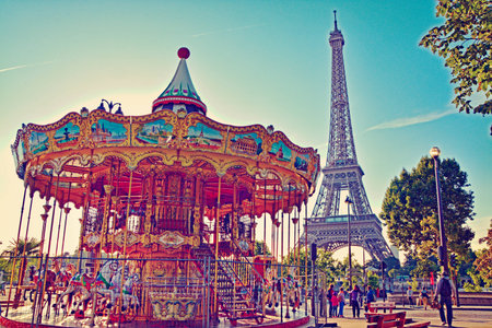 Eiffel Tower and vintage carousel in Paris, France. Retro styleのeditorial素材
