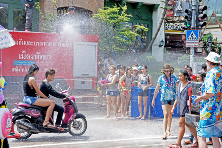 PATTAYA, THAILAND-APRIL 19,2014 Tourist and residents celebrate Songkran Festival - Thai New Year by splashing water on Pattaya streets. Traditional water pouring is symbol of washing all of bad awayのeditorial素材