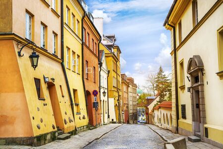 Street with colorful houses in Old Town of Warsaw, capital of Poland.の写真素材