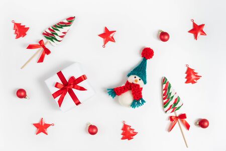 Christmas composition with snowman, lollipops and Christmas decorations.の写真素材