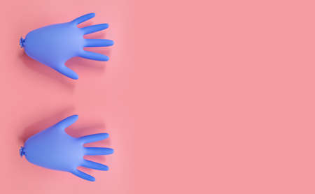 Inflated blue medical gloves on a pink background. Prevention of coronavirus, covid-19. Minimal healthcare concept. Flat lay, top view, copy space.の写真素材