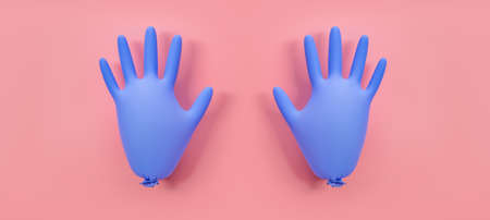 A pair of blue inflated protective gloves on a pink background. Prevention of coronavirus, covid-19. Healthcare concept. Flat lay, top view.の写真素材