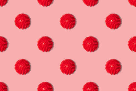 Seamless pattern with red coronavirus molecules on a pink background. Covid-19, healthcare concept....