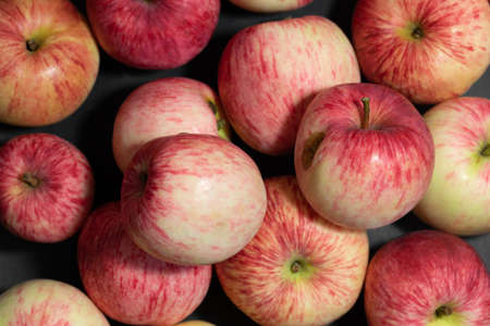 Apples closeup background. Red striped apples. Organic fruits. View from above. Autumn harvest.