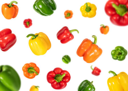 Set with flying colorful sweet peppers isolated on a white background. Falling bell pepper....