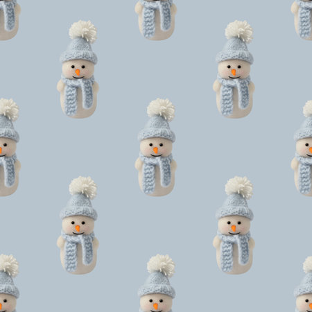 Seamless pattern with a happy toy snowman on a blue background. Christmas decorations. Happy new year.の写真素材