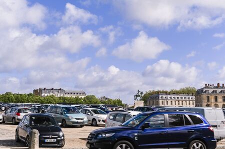 Gateway to the palace of Versailles. People at the main entrance and blue sky