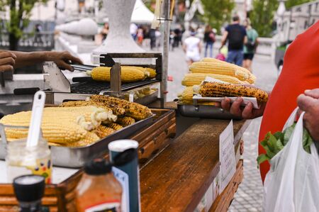 Grilled corn. Fast food in the city center for tourists. Selling food on the streetの写真素材