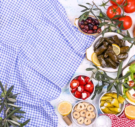 Turkish cabbage rolls and various snacks of national cuisine. Rice in grape leaves and olives. Food for a traditional oriental lunchの写真素材