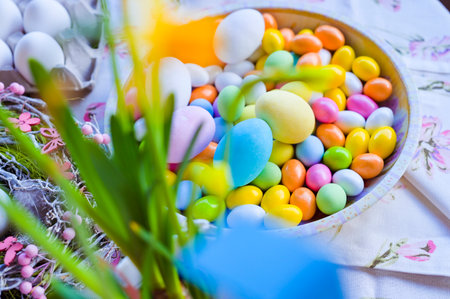 Bright colored eggs, large and small for Easter Sunday. Traditional treats. Copy space. Background of colored eggs.の写真素材