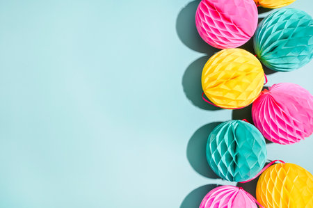 Garlands for the carnival on a blue background. Bright festive decor. Poster or postcard. Copy space. High quality photo in hard light. High quality photoの写真素材