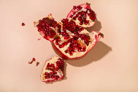 Large Pomegranate or Garnet. Fresh, juicy tropical and southern fruit. Organic foods with vitamins and oxidants. The photo was shot in a tough trend light.の写真素材