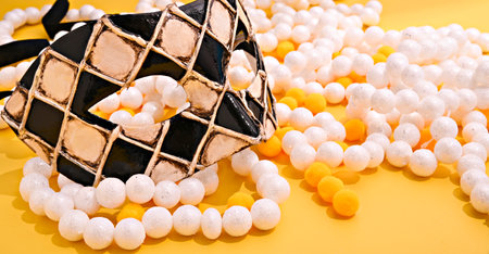 Carnival mask and festive garlands on a bright background. Image for a cover or poster. Venice concept in italy. Copy space. Bannerの写真素材