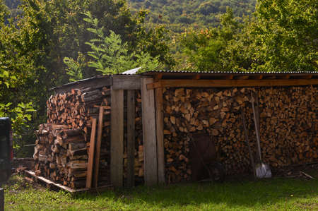 Chopped firewood for the fireplace. Autumn atmosphere in the mountainsの写真素材