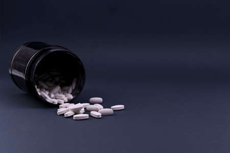 Sports nutrition supplements sports vitamins in pills. Fitness, bodybuilding, sport and healthy lifestyle conceptの写真素材