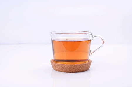 Jasmine tea in a glass cup on a white background. Aromatherapy and Ayurvedic herbs. Healthcare...
