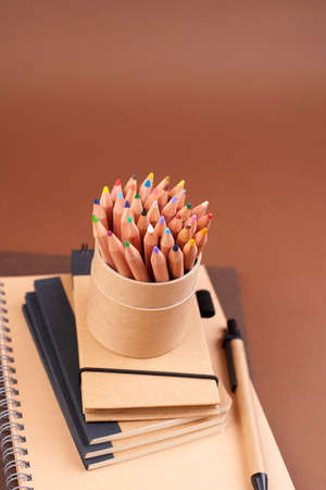 branding mockup with many craft paper and different subjects. Office desk with a paper notepad and a...
