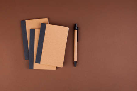 Recycled paper stationery. Notebooks and notebooks from eco materials. in the style of minimalism. High quality photo. Copy spaceの写真素材