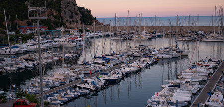 Scenic Marina at Sunset Tranquil Coastal View with Yachts and Boats. beautiful marina scene at...