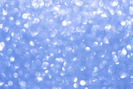 An abstract blue background with sparkle lights and bokeh. Useful as Christmas background or...