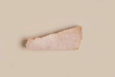 Stone podium on beige background for cosmetics or your logo. Top view. Copy space. Natural Stone pedestal, Products display with dolomite texture. Trendy template mockup. Flat Lay. Earth Tones.の写真素材