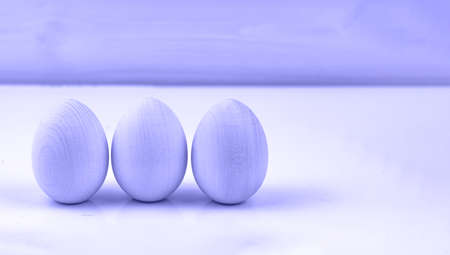 Very Peri. Color of the year 2022. Violet, purple colors. Row of Wooden eggs. Natural easter concept. Easter wooden eggs. Eco friendly style. Copy space for text. Zero Wasteの写真素材