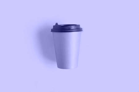 Very Peri. Color of the year 2022. Top view of a coffee paper cup. Mockup with lid. One of craft...