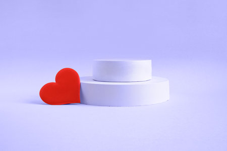 Podium for cosmetic product presentation. Abstract minimal geometrical form. Cylinder podium sphere, geometric forms, soft shadow. Scene to show products. Showcase, display case. Flat lay, side viewの写真素材