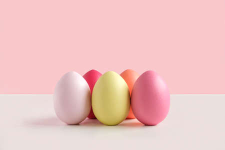 Easter banner with colorful Easter Egg in a row. Border over a yellow background. Above view with...