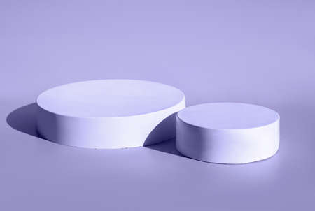 Podium for cosmetic product presentation. Abstract minimal geometrical form. Cylinder stone sphere two forms. Sun shadow. Scene to show products. Showcase, display case. Trendy sunlight. Side viewの写真素材