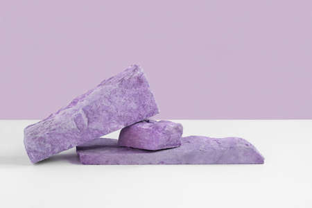 Stone Podium for promotion on violet Background. natural pedestal. Two stone podiums. beauty product mockup. scene to show products. Show case, display case. Front view, soft shadow. rock. Very peri.の写真素材