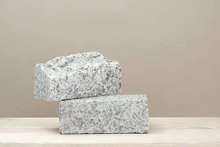 Stone Podium for promotion on beige Background. natural pedestal. Two stone podiums. beauty product mockup. scene to show products. Show case, display case. Front view, soft shadow.の写真素材