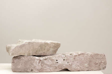 Stone Podium for promotion on beige Background. natural pedestal. Two stone podiums. beauty product...