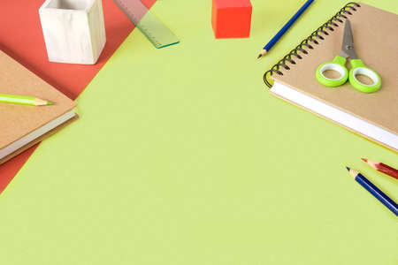 Colorful school supplies on light green background. Many Office Stationery Items flat lay. Back to...