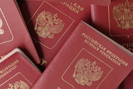 Russian Passports. Travel Documents. Foreign Passport. Closeup of National Passport of the Russian Federation. Vacation and tourism concept. high angle view. flat lay.の写真素材