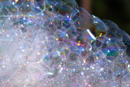 A Lot of Soap Bubbles are Bursting. Bubbles Surface on Nature Background. Texture of Big Foam....
