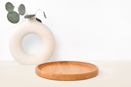 Round Wooden Podium for Food, Products against White Wall. Ceramic Vase. Empty Natural Form. Pedestal Showing Eco Organic Cosmetics, Jewelry. Trendy Minimal Style Mock Up. Neutral Studio Background.の写真素材