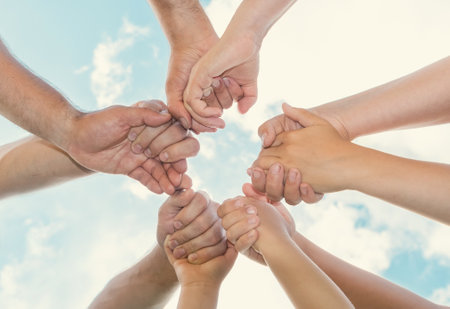 Joined hands as a team. business teamwork. Close up group of friends meeting join hands together....
