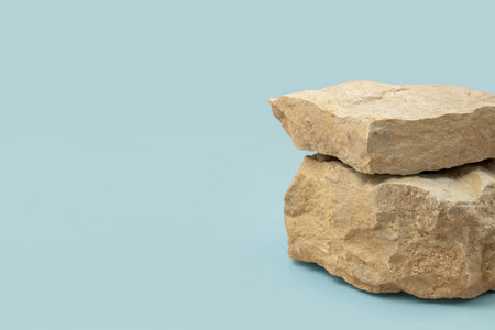 Stone podium for cosmetic product presentation. Abstract minimal backdrop. Two rock form. Light Blue Studio Background. scene to show. Show case display case. 3D front view. trendy neutral color. Spaceの写真素材