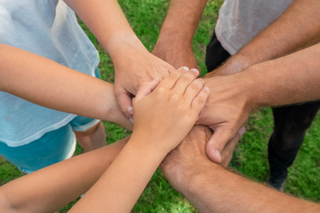 Joined hands as a team. business teamwork. Close up group of multiracial friends meeting join hands together. diversity people. partnership volunteer community. Diverse Multiethnic Partners. top viewの写真素材