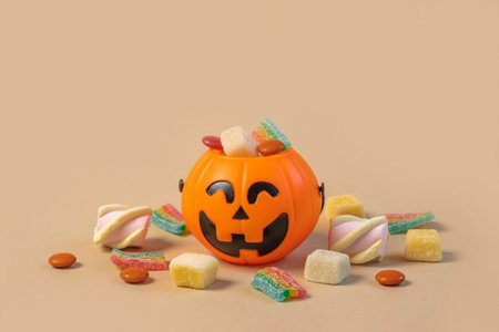 Halloween Jelly Beans. Happy Halloween Party Border Beige Background. Aesthetic Accessories Banner. Spooky Orange Pumpkin Candy Bucket. Modern Holiday Design. Thanksgiving Trendy Fall Posterの写真素材
