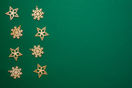 New Year Green Background. Wooden Decoration. Stars and Snowflakes shape. Top view.の写真素材
